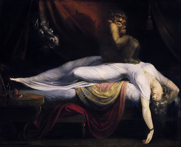 'The Nightmare' painting by Henry Fuseli.
A demon creature sits on top of a sleeping woman dressed in white.
Behind them, a horse with light gray eyes looks at them, in front of a red curtain.